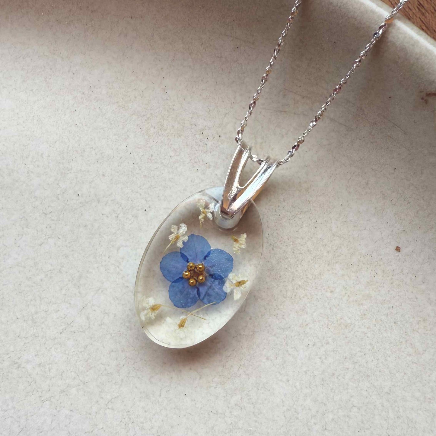 Collar Peulla en plata 925, con flor no me olvides.